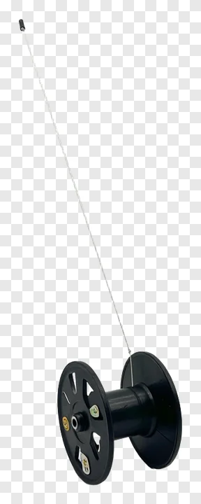 Black kite string spool with a thin line extending upward.