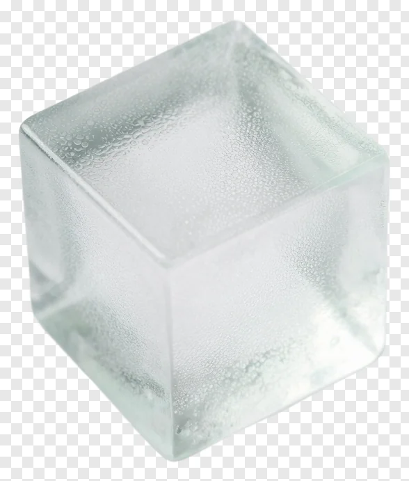 A frosted glass cube with condensation droplets, tilted on a white surface.