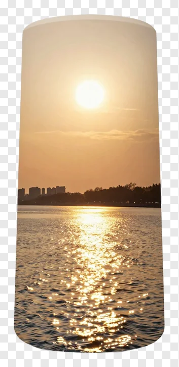 Sunrise over a river with golden reflections.