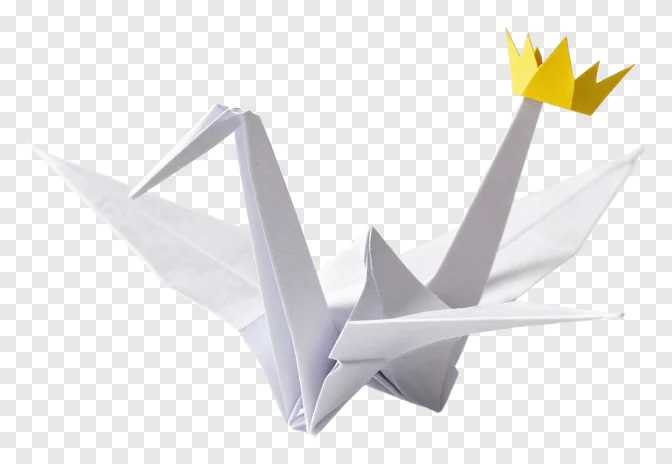 White paper crane wearing a gold crown.