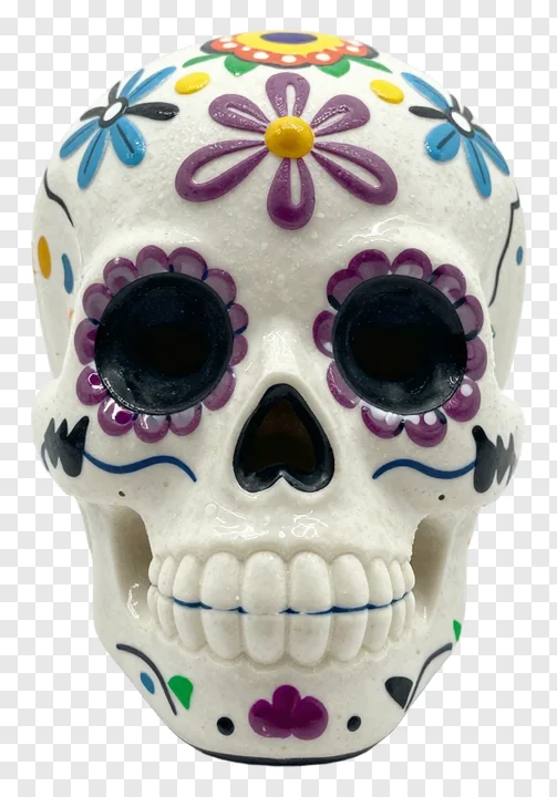 A decorated sugar skull with colorful flowers and black eye sockets.