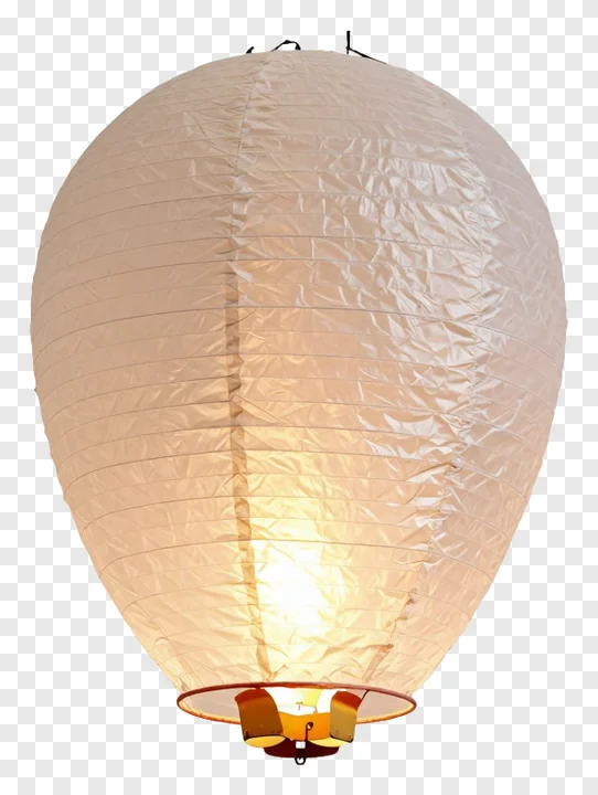 A lit paper sky lantern with a warm glow.