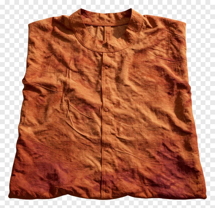 A folded sleeveless shirt dyed with saffron.