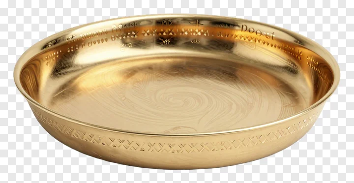 A golden brass thali with engraved designs for Diwali pooja.
