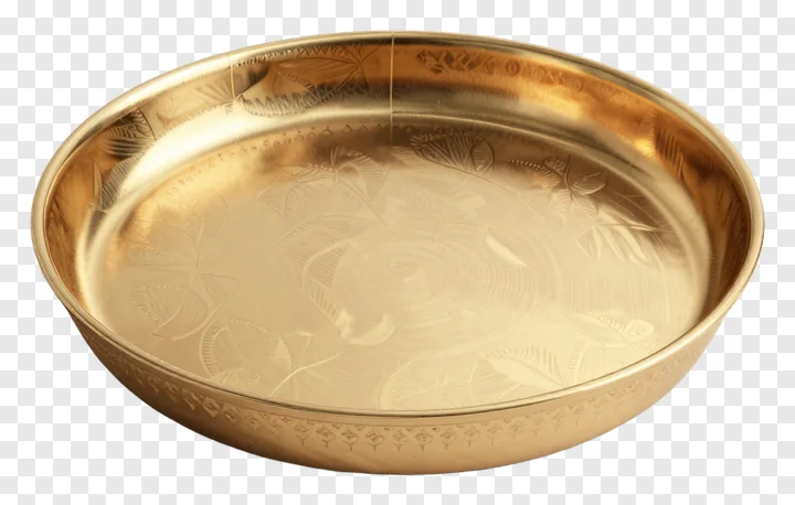 Golden pooja thali with floral engravings.