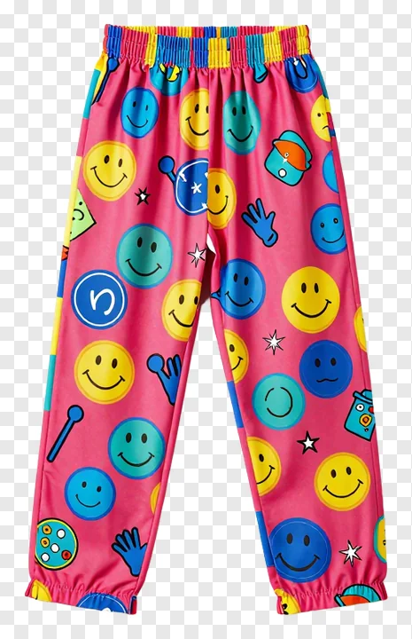 Pink pants decorated with smiling emojis and party symbols.