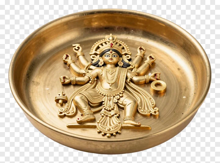 Golden thali with embossed Durga goddess figure.