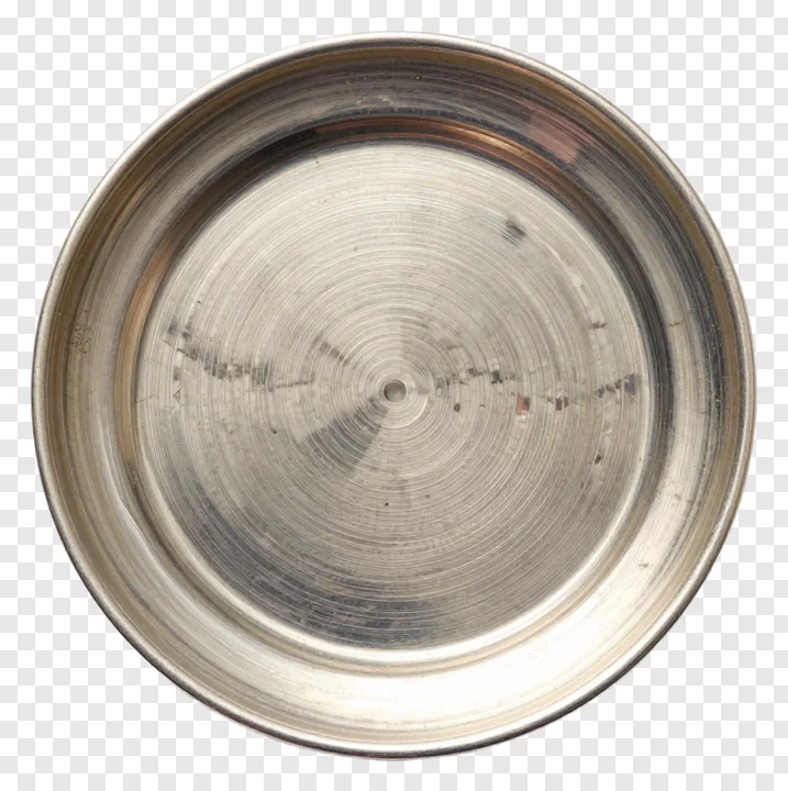 Top-down view of a silver aarti plate with a central hole.