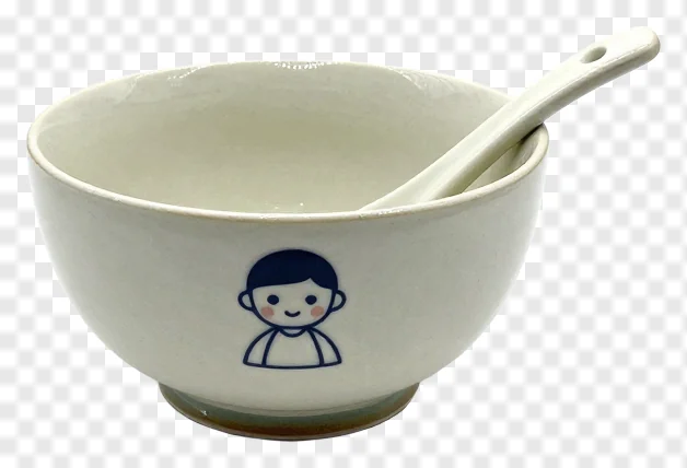 White ceramic bowl with cartoon character and spoon.