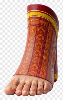 A foot decorated with red and gold geometric designs.