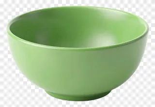 A green ceramic bowl on a white surface.