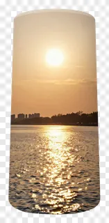 Sunrise over a river with golden reflections.