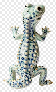 Ceramic gecko figurine with blue and white spots.