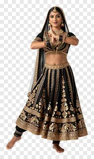 A woman in a black and gold embroidered lehenga performing a Garba dance.