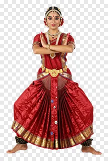 A dancer in a red traditional Indian costume posing with arms crossed.