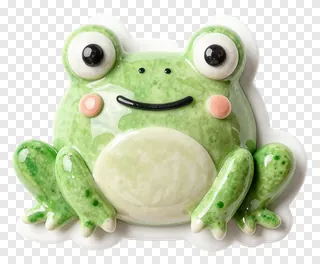 A green ceramic frog charm with big eyes and a smile.
