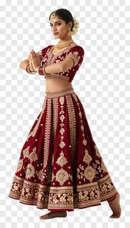 A woman in a red velvet lehenga dancing Garba.