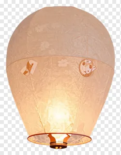 An orange paper sky lantern with animal patterns glowing from within.
