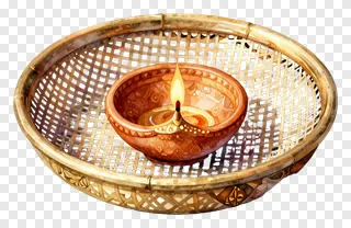 A lit clay diya in a bamboo sieve.