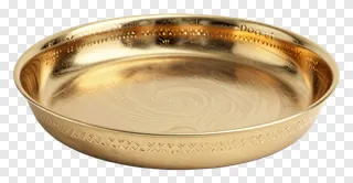 A golden brass thali with engraved designs for Diwali pooja.
