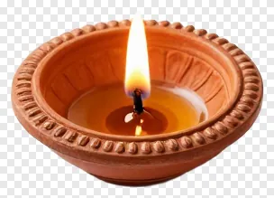 A terracotta diya with a single flame.