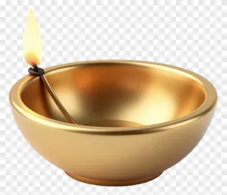 A golden diya with a lit flame.