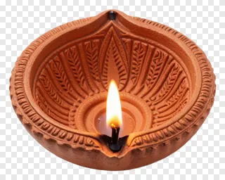 A lit terracotta diya lamp with detailed patterns.
