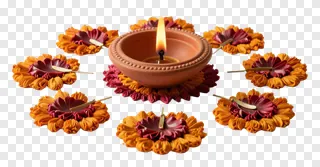 A lit clay diya surrounded by decorative fabric flowers.