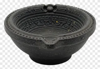 Black miniature diya holder with detailed carvings.
