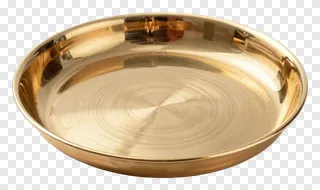 A polished brass pooja thali with circular grooves.