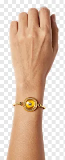A golden eye-shaped bracelet on a bare wrist.