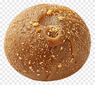 Round sandesh sweet with caramel swirls and sprinkles.