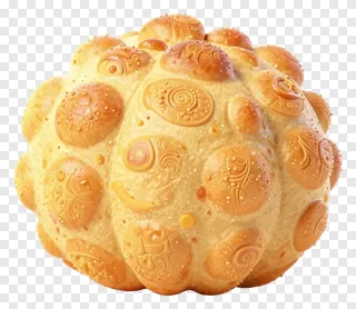 A round, golden bread with decorative patterns.