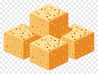 Four golden til ladoo sweets in a pyramid shape.