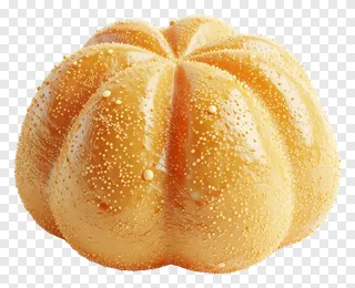 A glossy golden kua sweet with speckles.