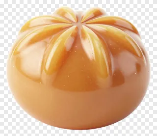 A glossy golden sandesh sweet with a star-shaped top.