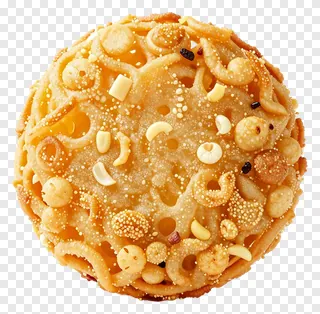 A round fried pakora ball with sesame seeds and nuts.