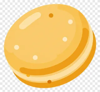 A golden til ladoo sweet with highlights.