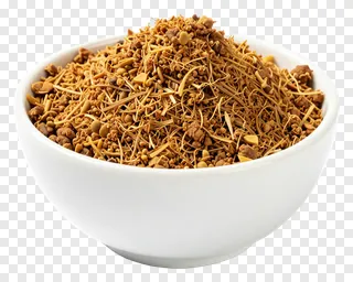A white bowl containing dried neem leaves and jaggery.