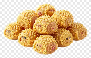 A stack of ornate Durga Puja sweets with facial designs.